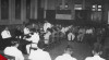 Foto suasana upacara perjanjian persahabatan antara Indonesia dan Pakistan di Kementerian Luar Negeri RI. Tampak Duta Besar Pakistan Mudhabbir Husein Choudury, Menteri Luar Negeri Mukarto Notowidigdo duduk berhadapan, 7 Mei 1953.